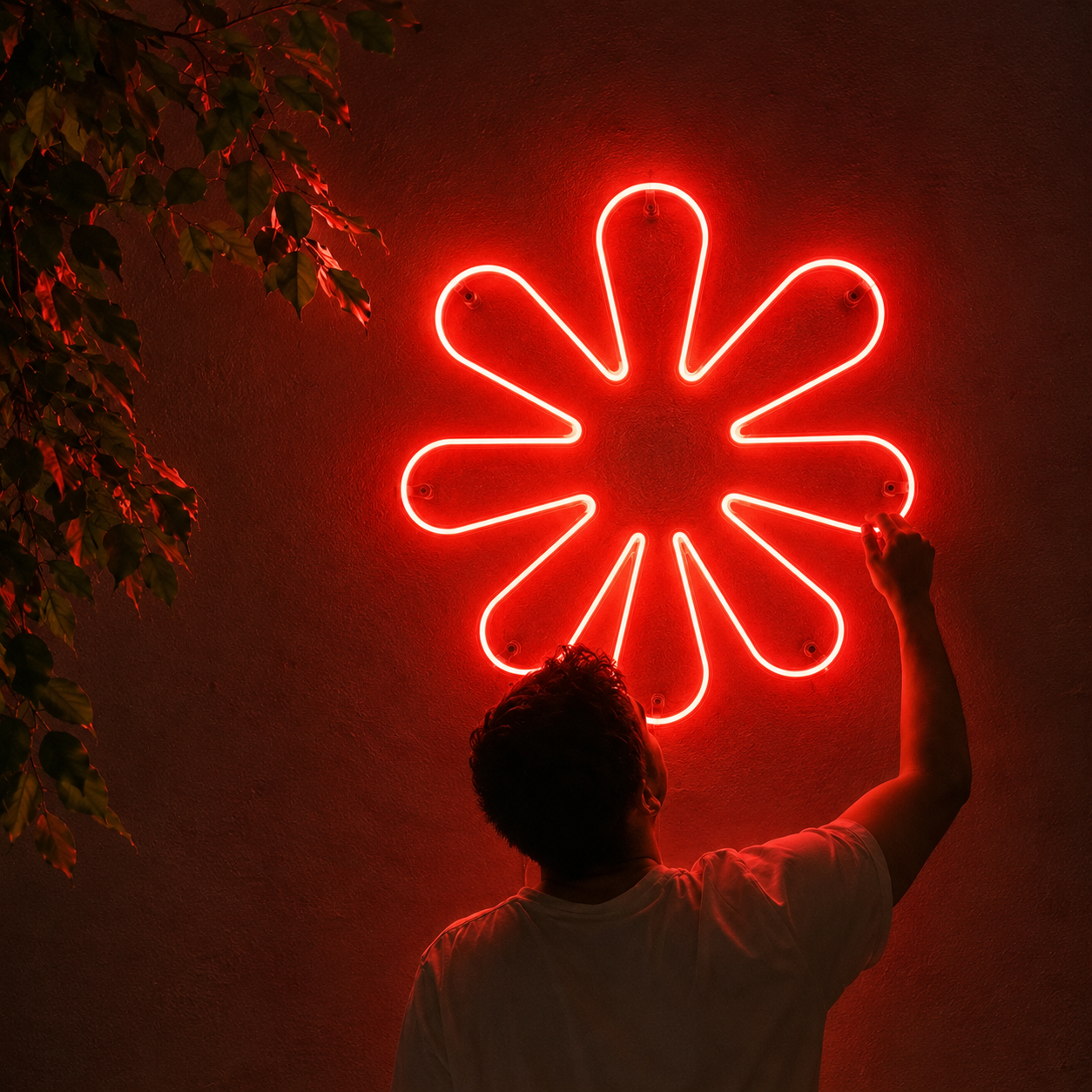 The Quenatic mark, recreated as a neon sign, photographed at our studio at night